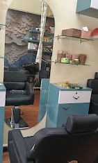Styling station with mirror and chairs